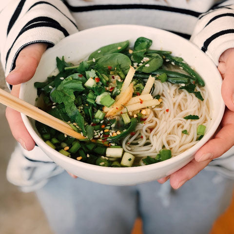 wood chopsticks in a noodle bowl